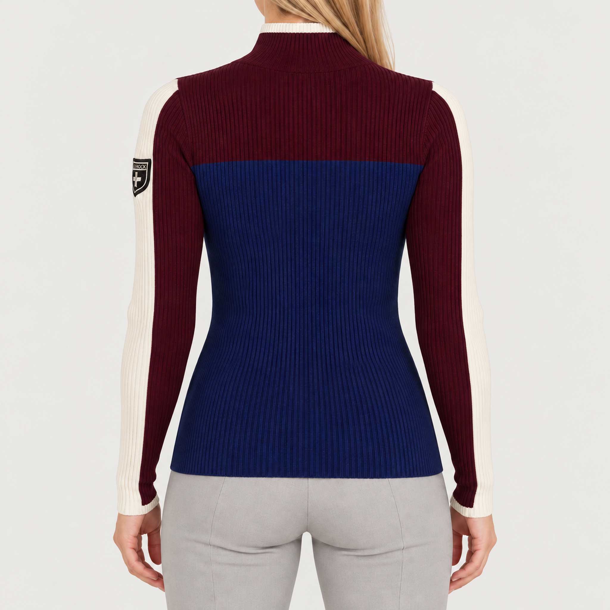 Model wearing Alp n Rock women's Ali Rib Sweater in Deep Blue/Deep Red, back view.