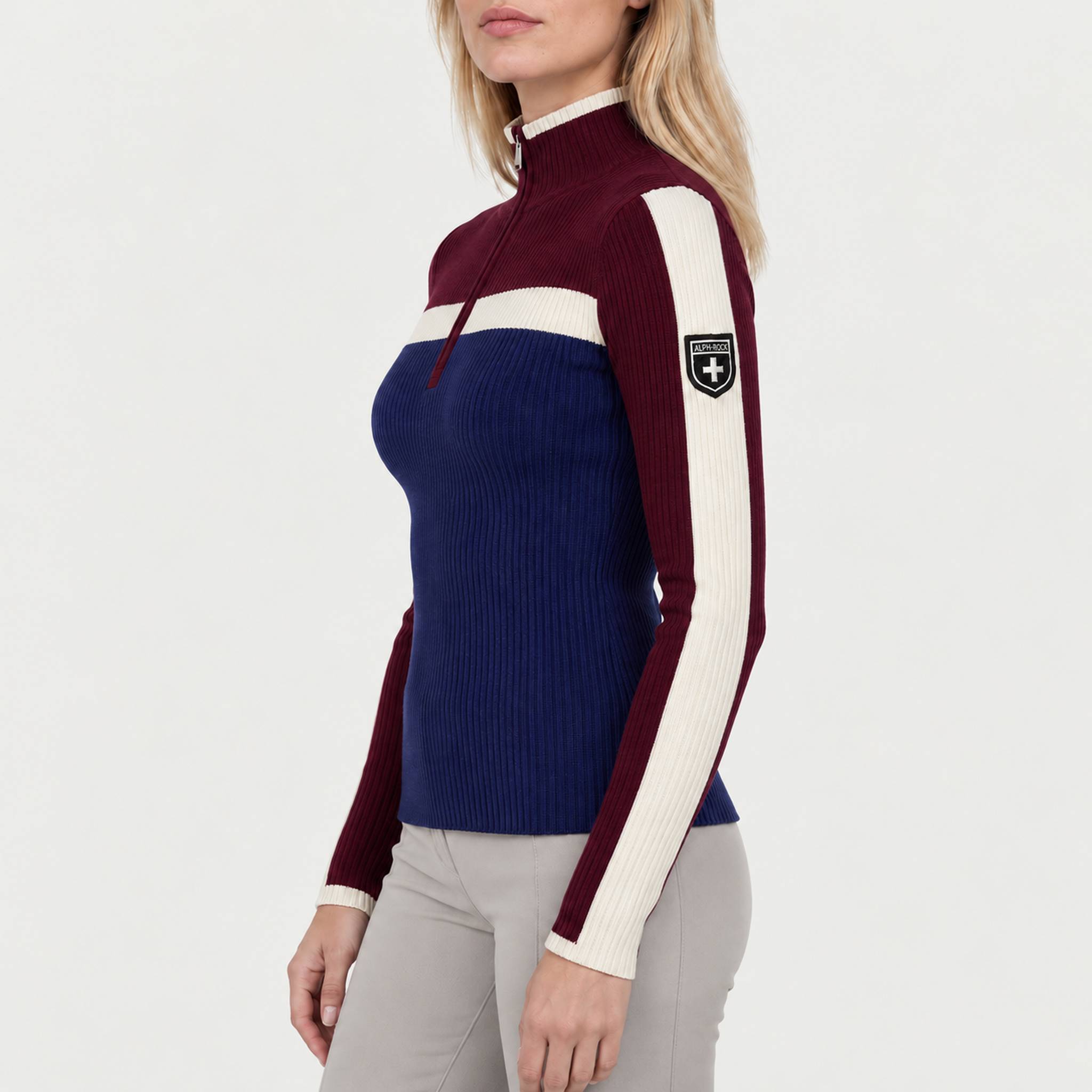 Model wearing Alp n Rock women's Ali Rib Sweater in Deep Blue/Deep Red, side view.