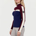 Model wearing Alp n Rock women's Ali Rib Sweater in Deep Blue/Deep Red, side view.