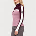 Model wearing Alp n Rock women's Ali Rib Sweater in Smokey Rose/Cabernet, side view.