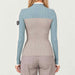 Model wearing Alp n Rock women's Ali Rib Sweater in Stone/Silver Blue, back view.