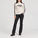 Alp n Rock women's Apres All Day Mockneck in fossil, full outfit with black softshell ski pants.
