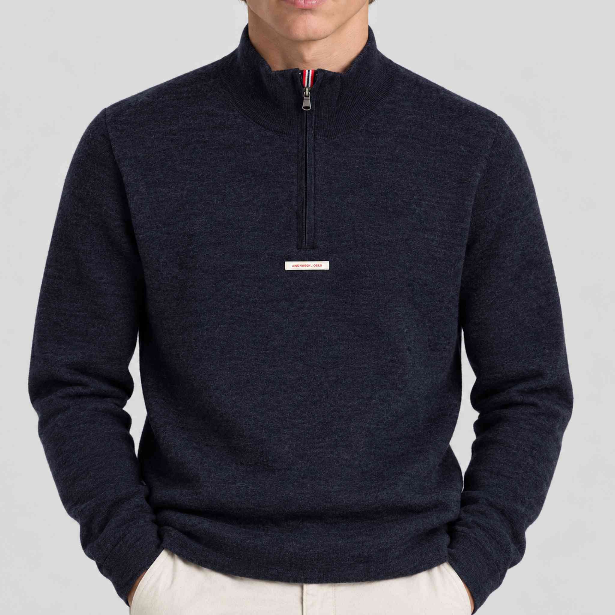 Amundsen Boiled Half Zip in Faded Navy, close-up fabric detail on model.