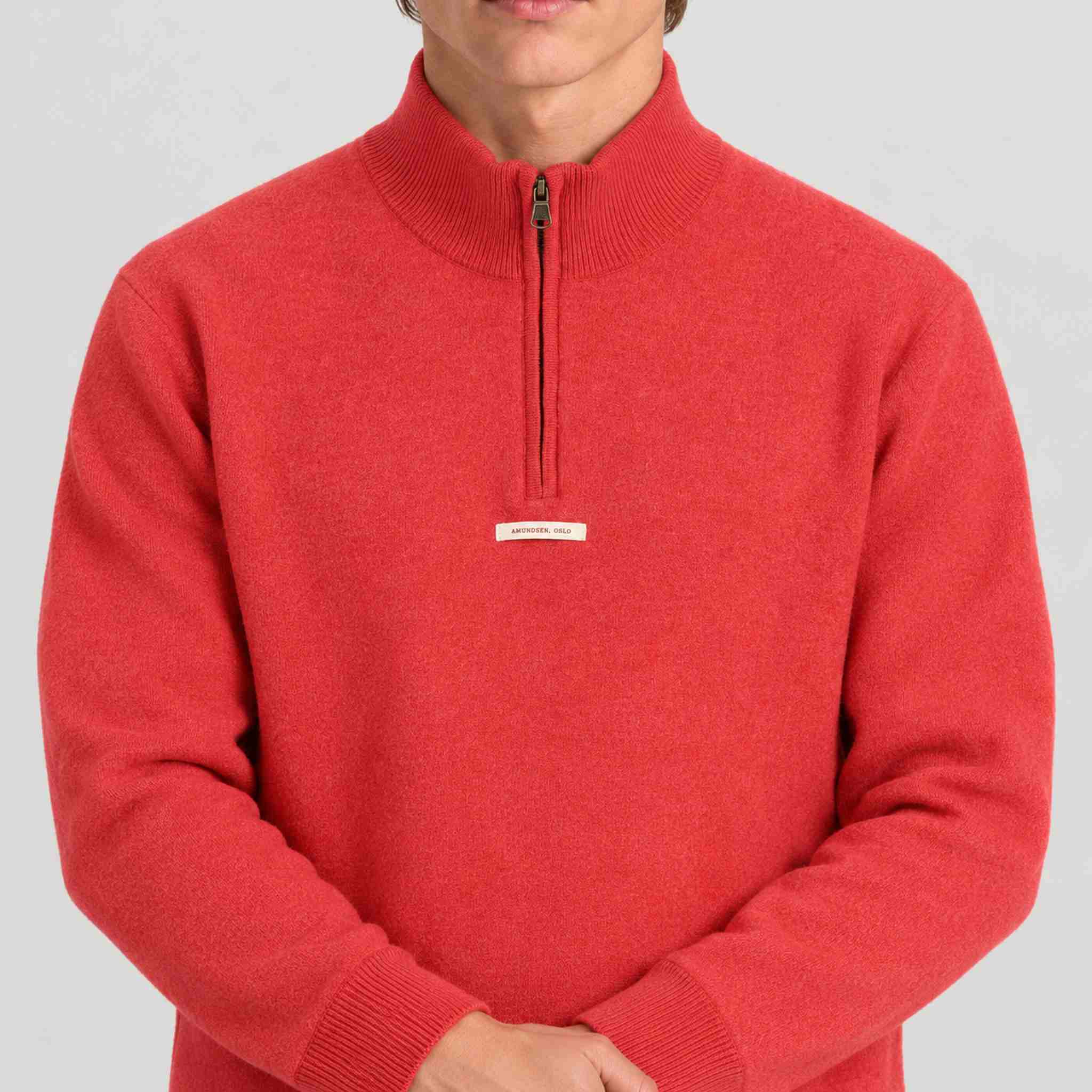 Amundsen Boiled Half Zip in Weathered Red, close-up fabric detail on model.