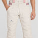 Amundsen Concord Ski Pants in Natural, close-up fabric detail on model.