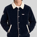 Amundsen Harvester Overshirt in True Navy, close-up fabric detail on model.