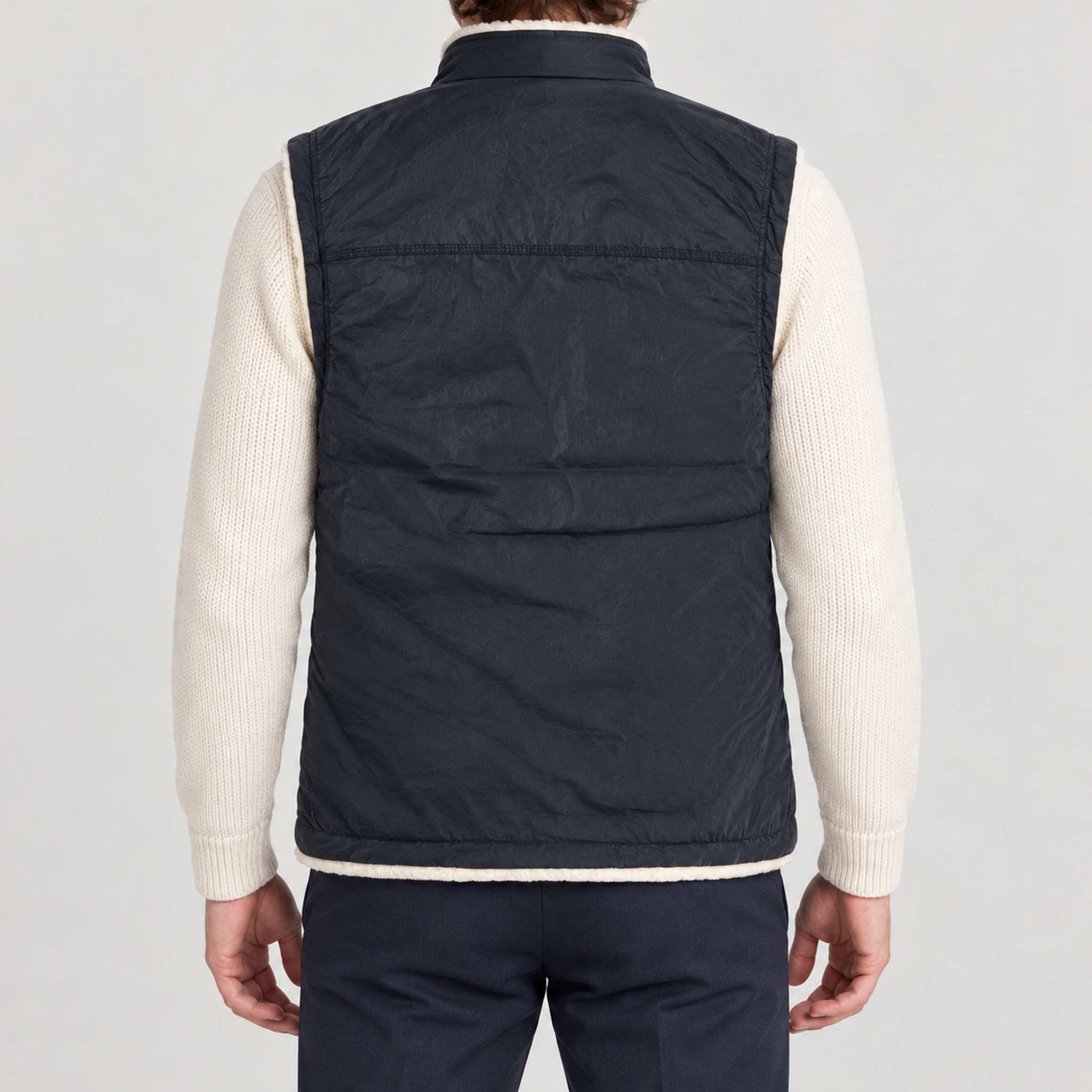 Amundsen Harvester Reverso Waxed Vest, back view on model, navy waxed side.