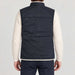 Amundsen Harvester Reverso Waxed Vest, back view on model, navy waxed side.