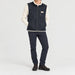 Amundsen Harvester Reverso Waxed Vest, full outfit view on model, navy waxed side.