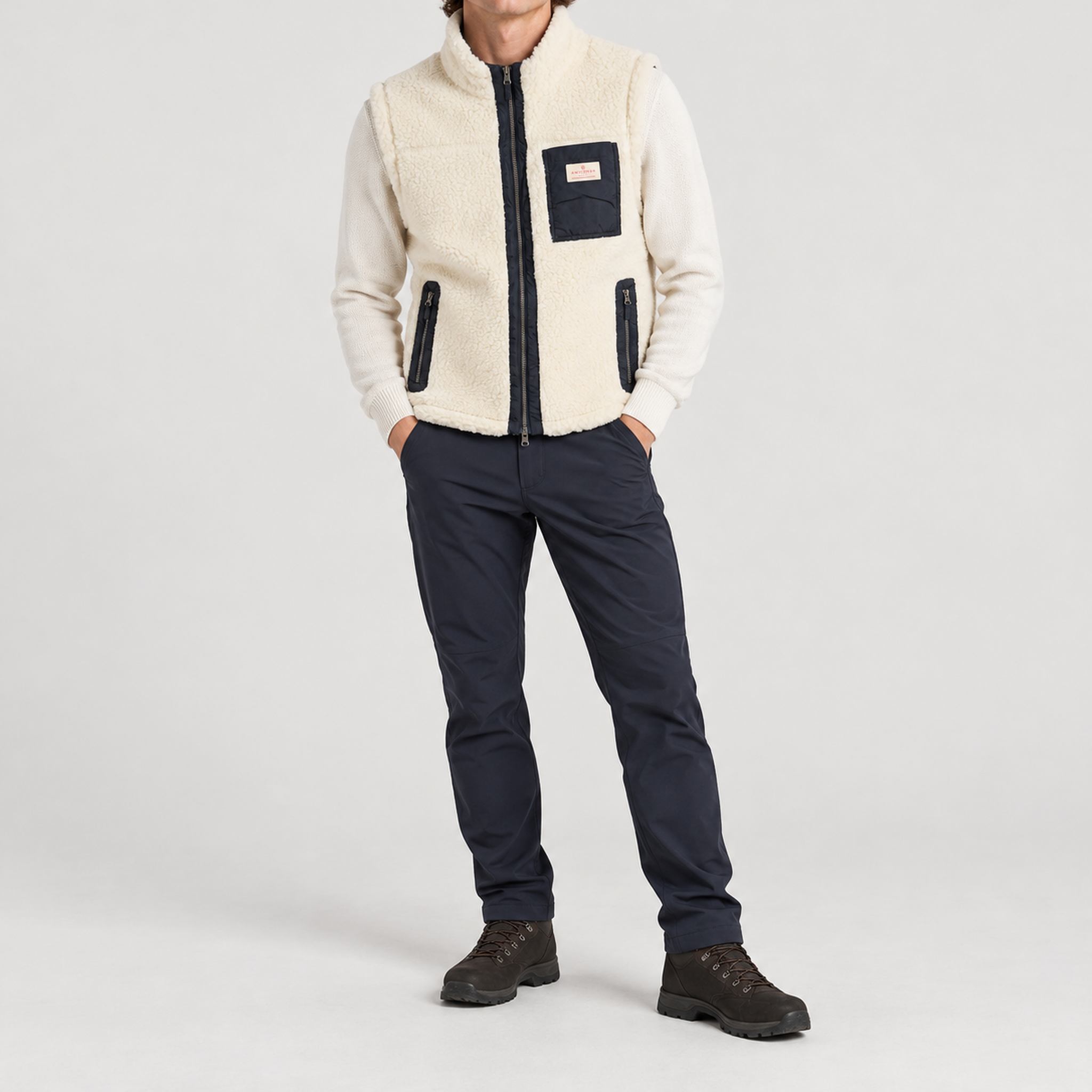 Amundsen Harvester Reverso Waxed Vest, full outfit view on model, cream fleece side.