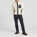 Amundsen Harvester Reverso Waxed Vest, full outfit view on model, cream fleece side.