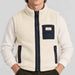 Amundsen Harvester Reverso Waxed Vest, close-up fabric detail on model, cream fleece side.