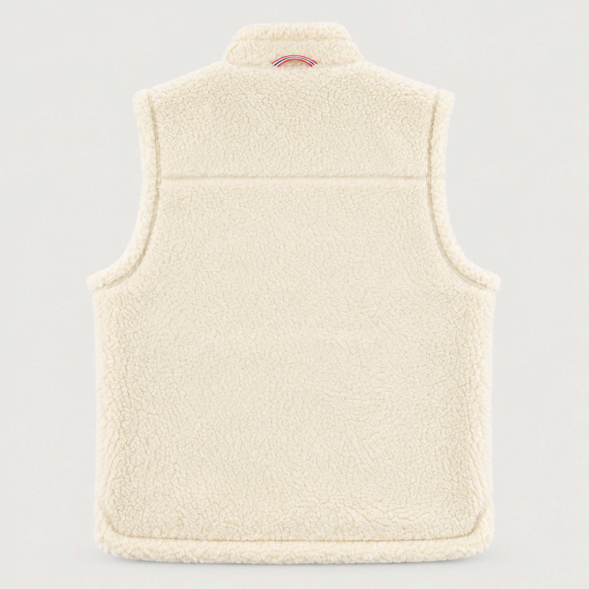 Amundsen Harvester Reverso Waxed Vest, back product view, cream fleece side.