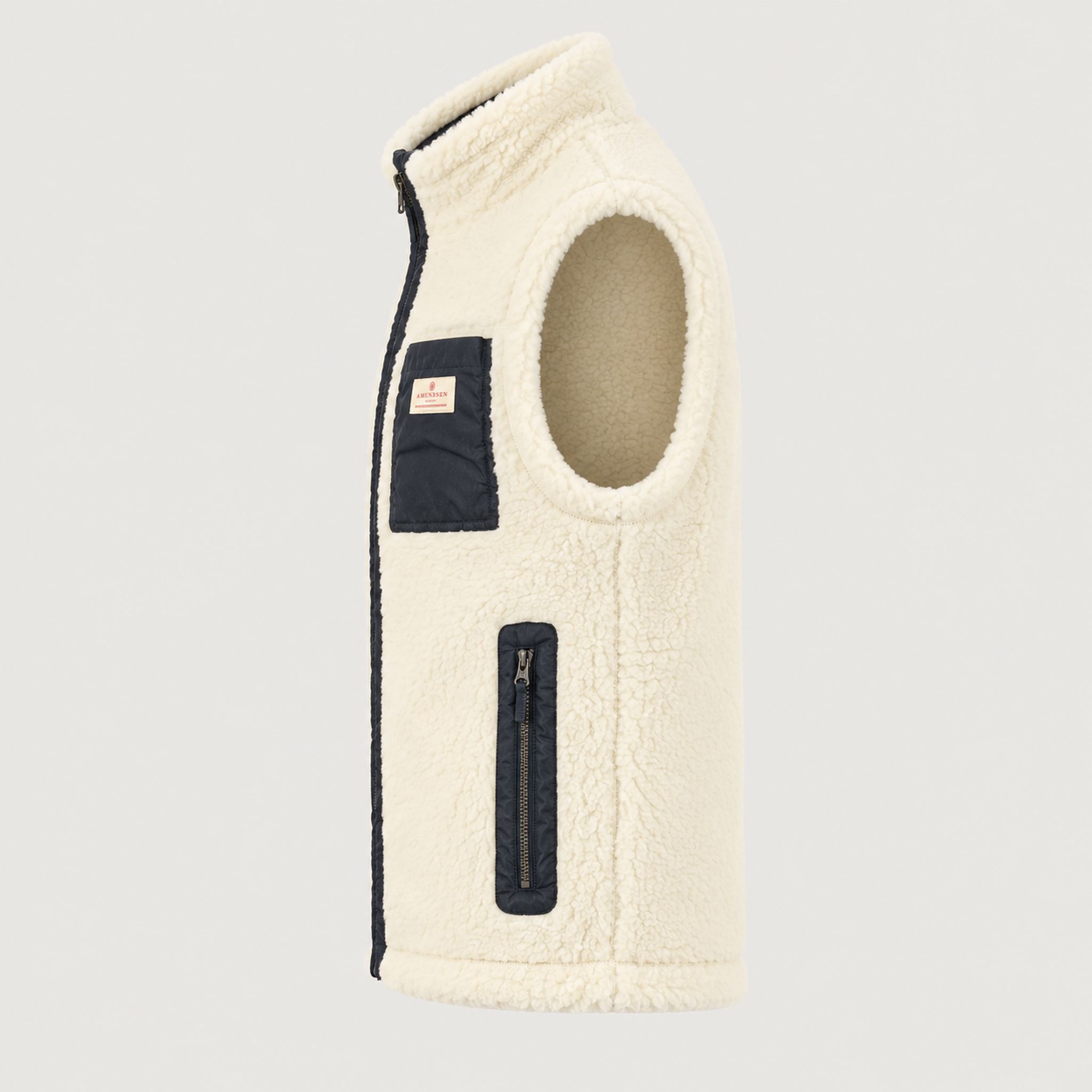 Amundsen Harvester Reverso Waxed Vest, side product view, cream fleece side.