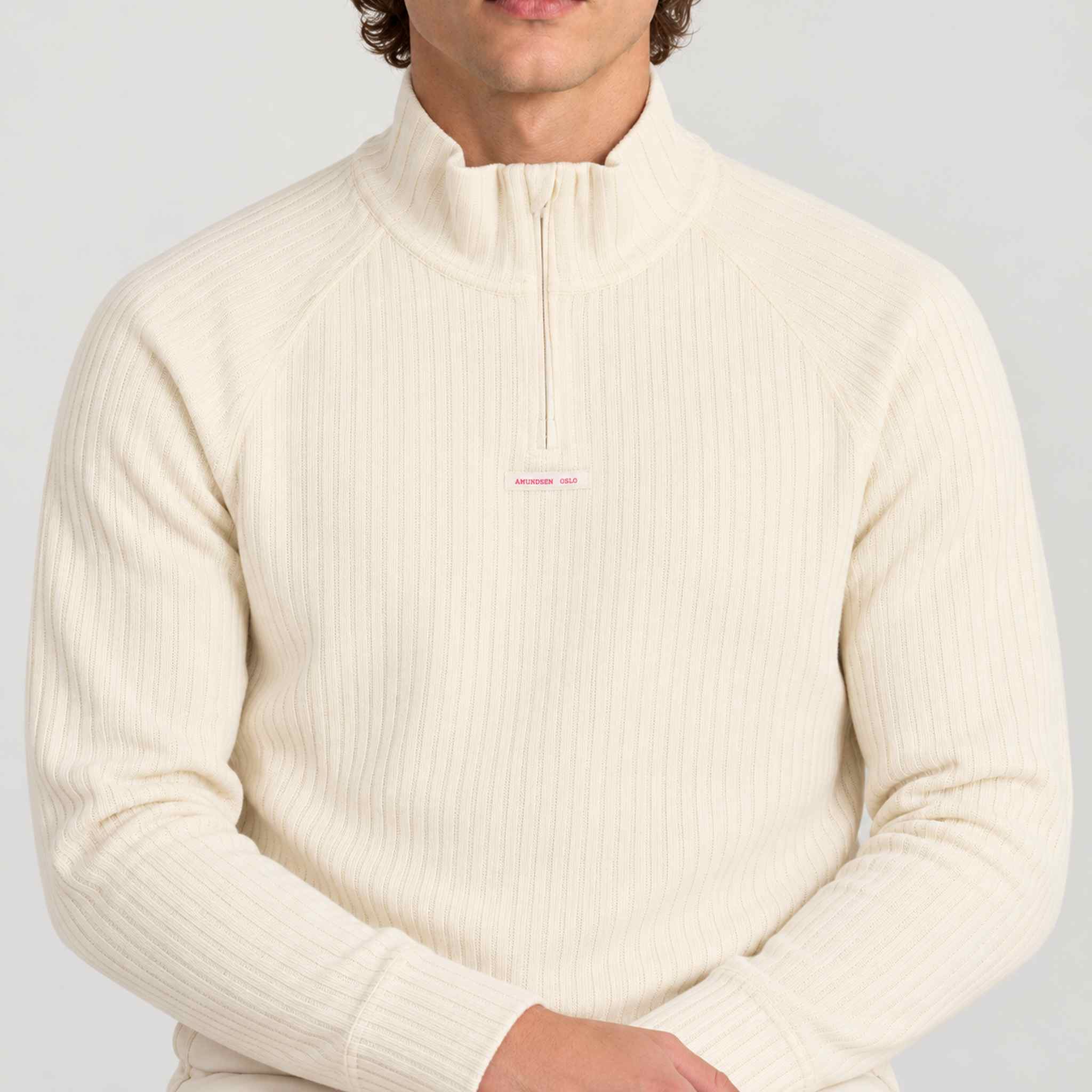 Amundsen Hero's Hide Half Zip, close-up fabric detail on model.