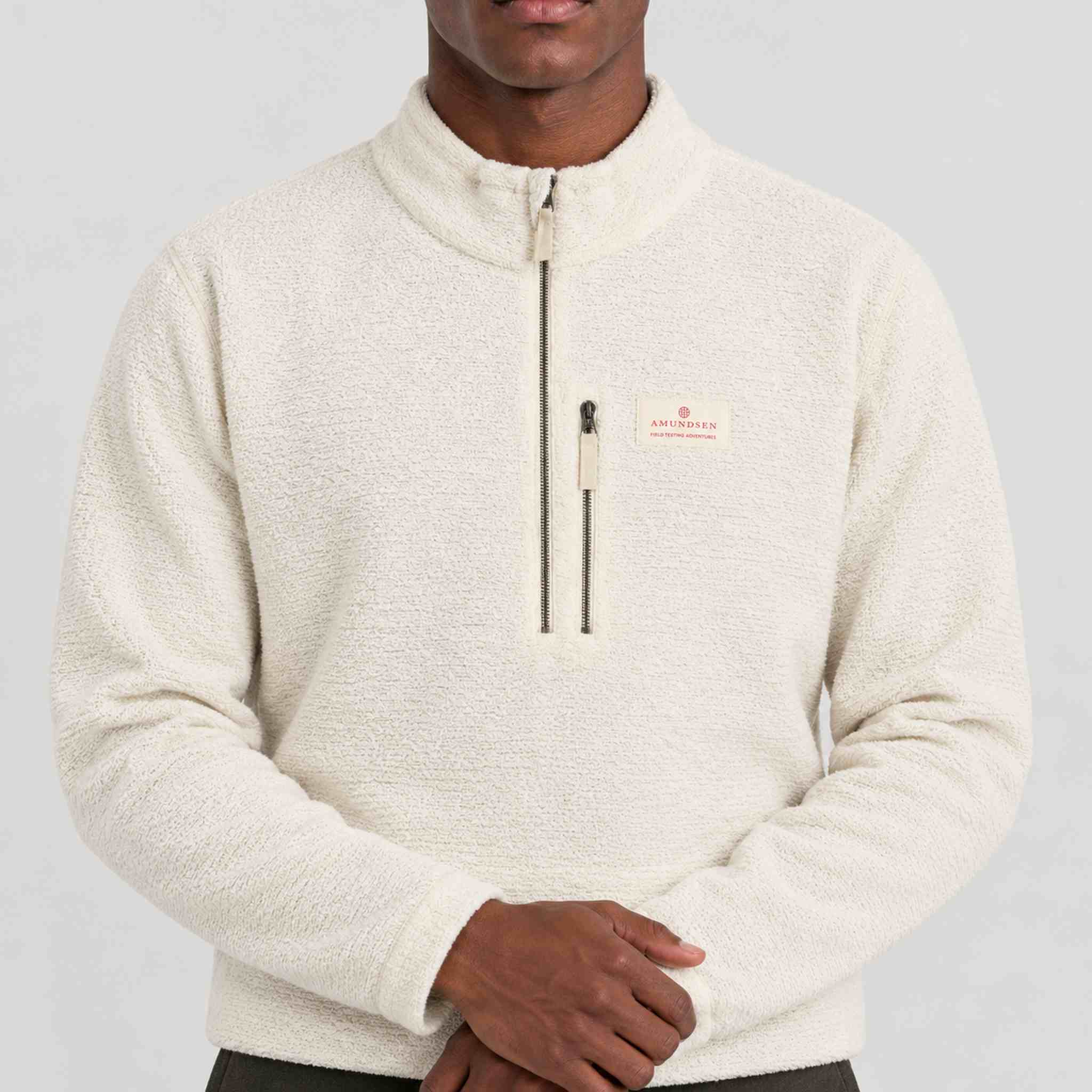 Amundsen Hut Half Zip in Oatmeal, close-up fabric detail on model.