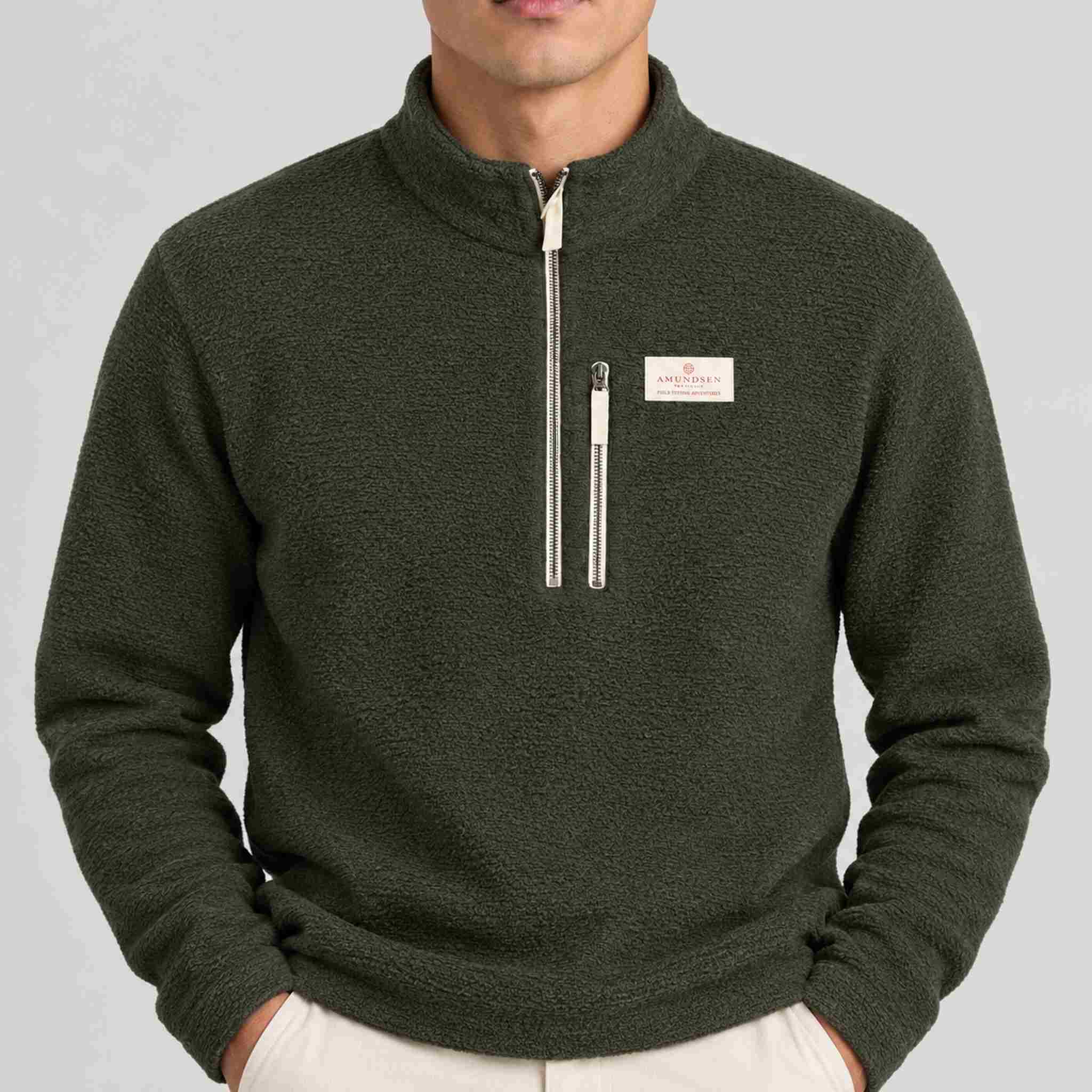 Amundsen Hut Half Zip in Spruce Green, close-up fabric detail on model.
