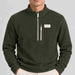 Amundsen Hut Half Zip in Spruce Green, close-up fabric detail on model.
