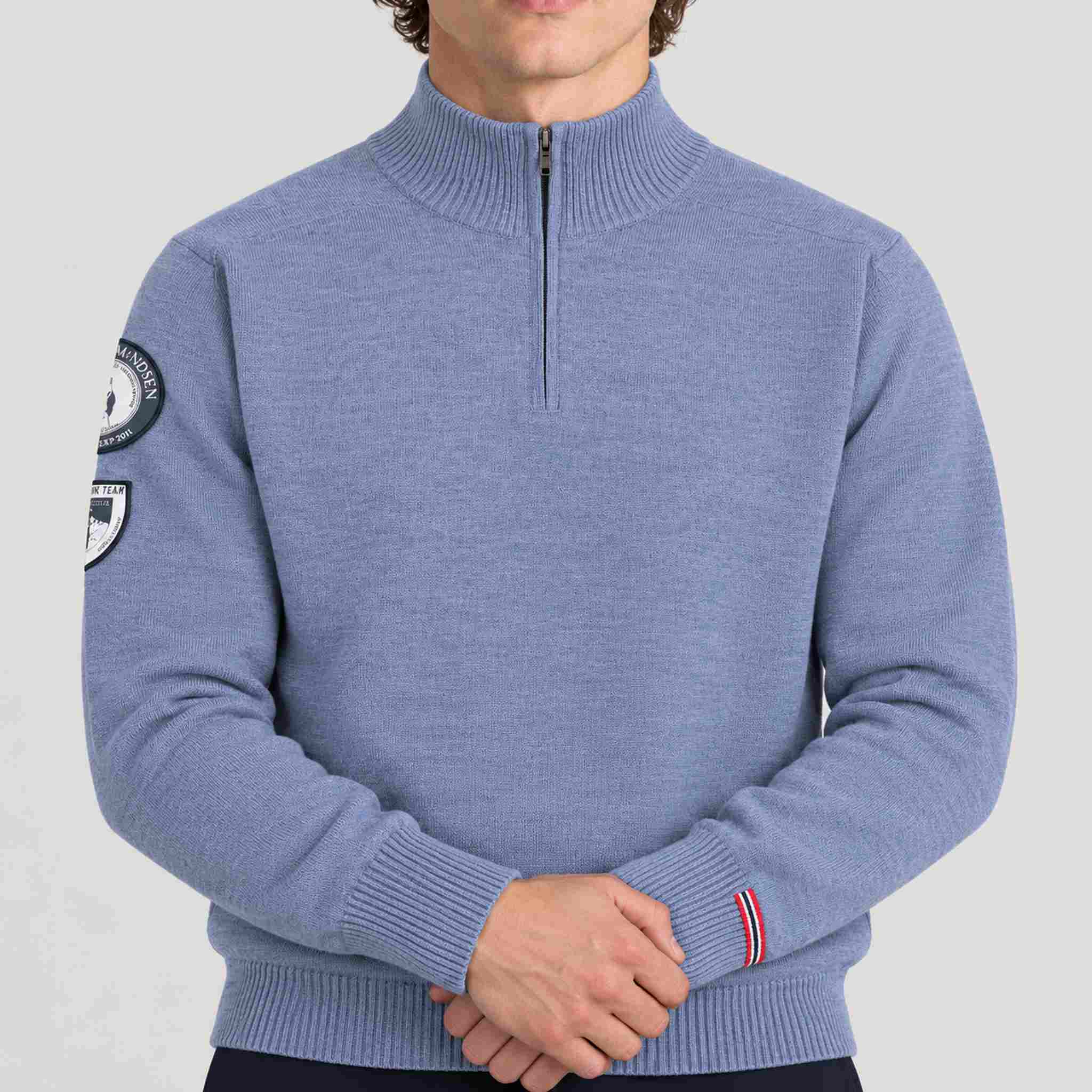 Amundsen Peak Half Zip in Denim Blue, close-up fabric detail on model.