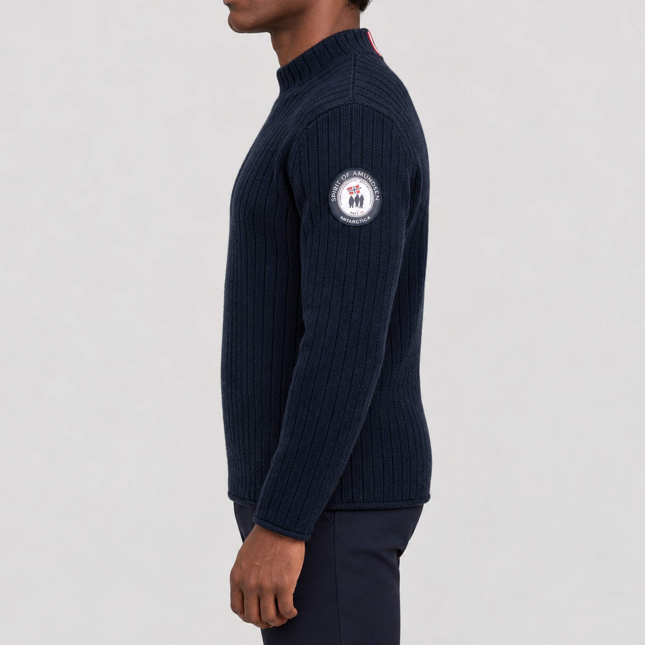 Amundsen Roald Roll Neck in Faded Navy, side view on model.