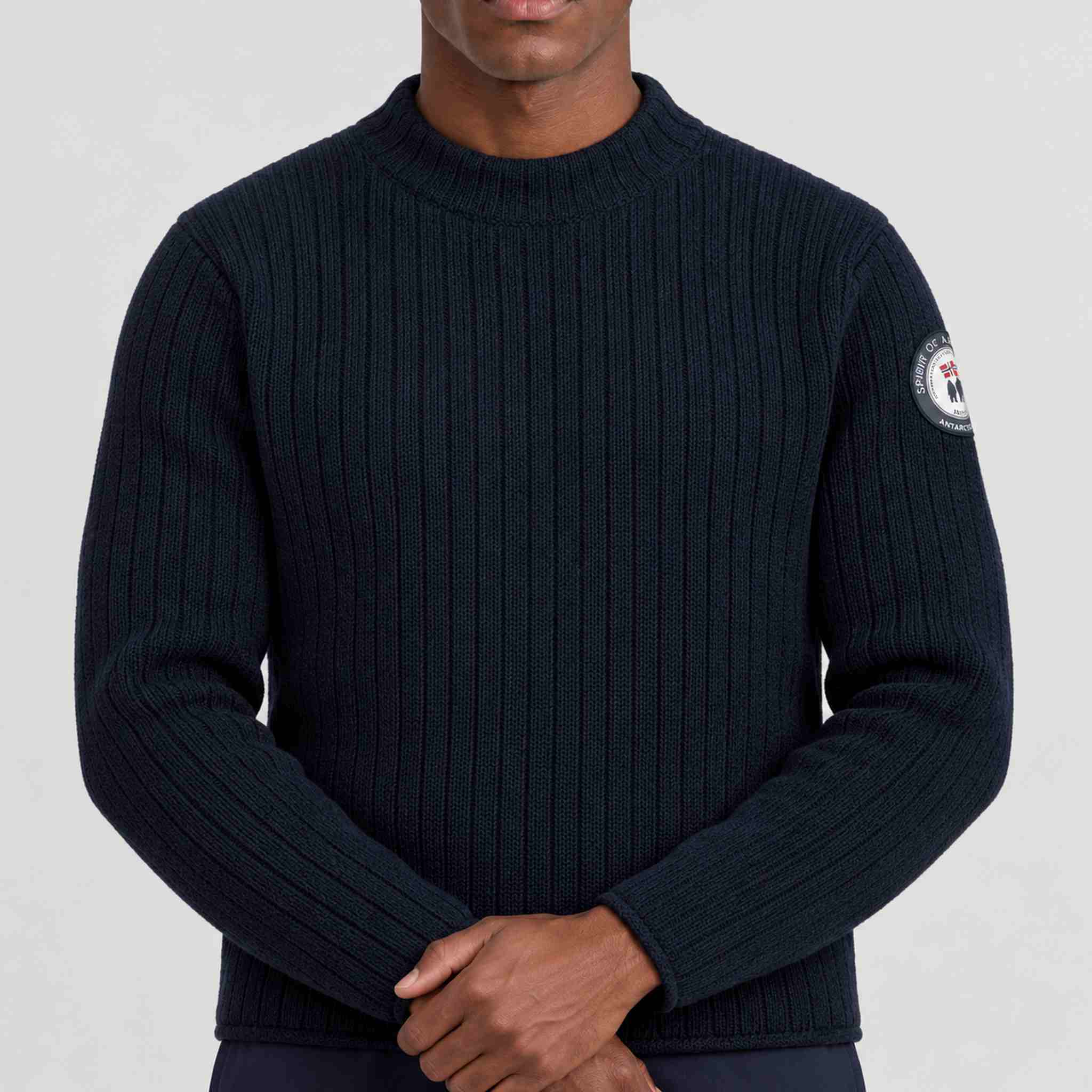 Amundsen Roald Roll Neck in Faded Navy, close-up fabric detail on model.