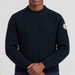 Amundsen Roald Roll Neck in Faded Navy, close-up fabric detail on model.