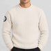 Amundsen Roald Roll Neck in Oatmeal, close-up fabric detail on model.