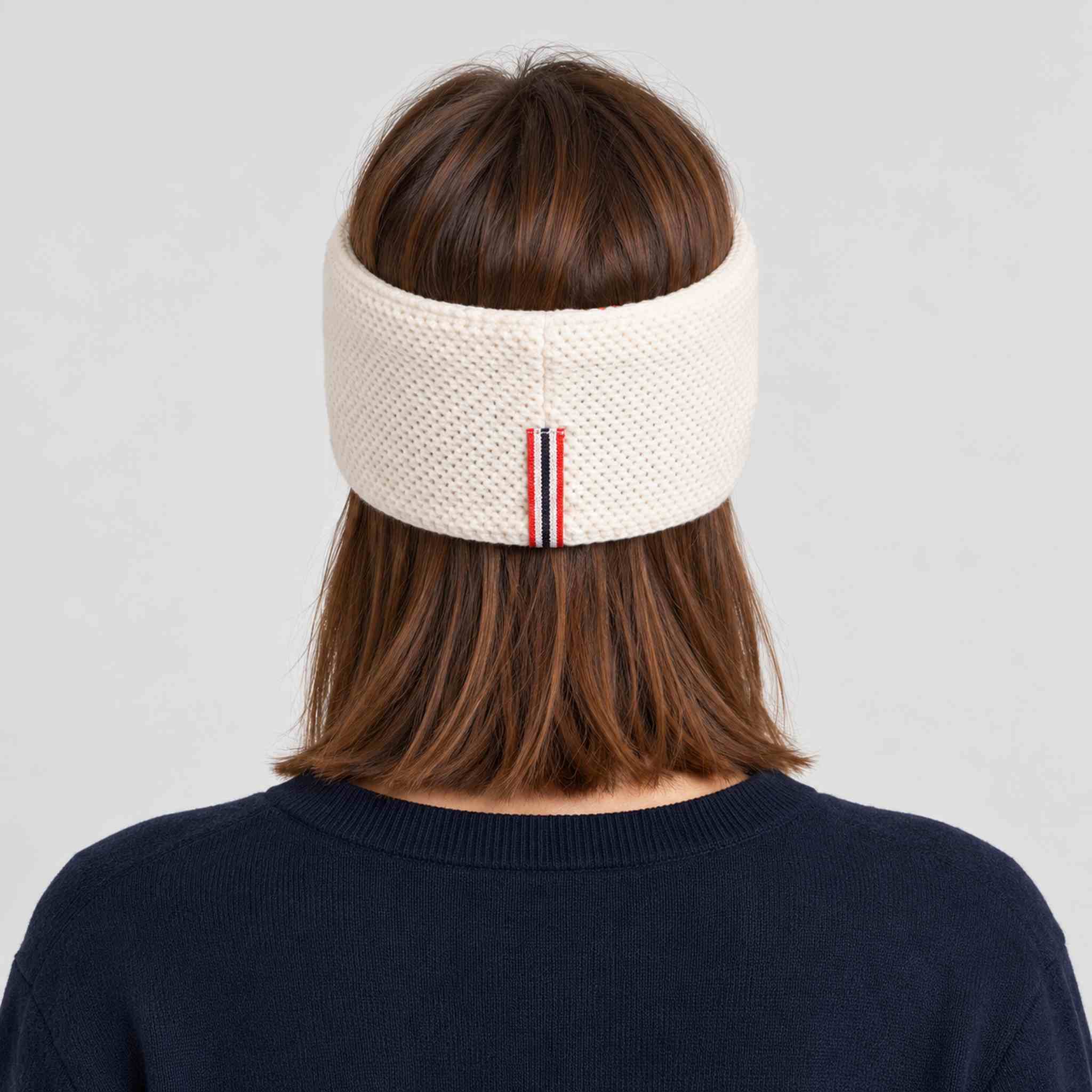Amundsen Antarctica Headband in White, back view worn by a female model.