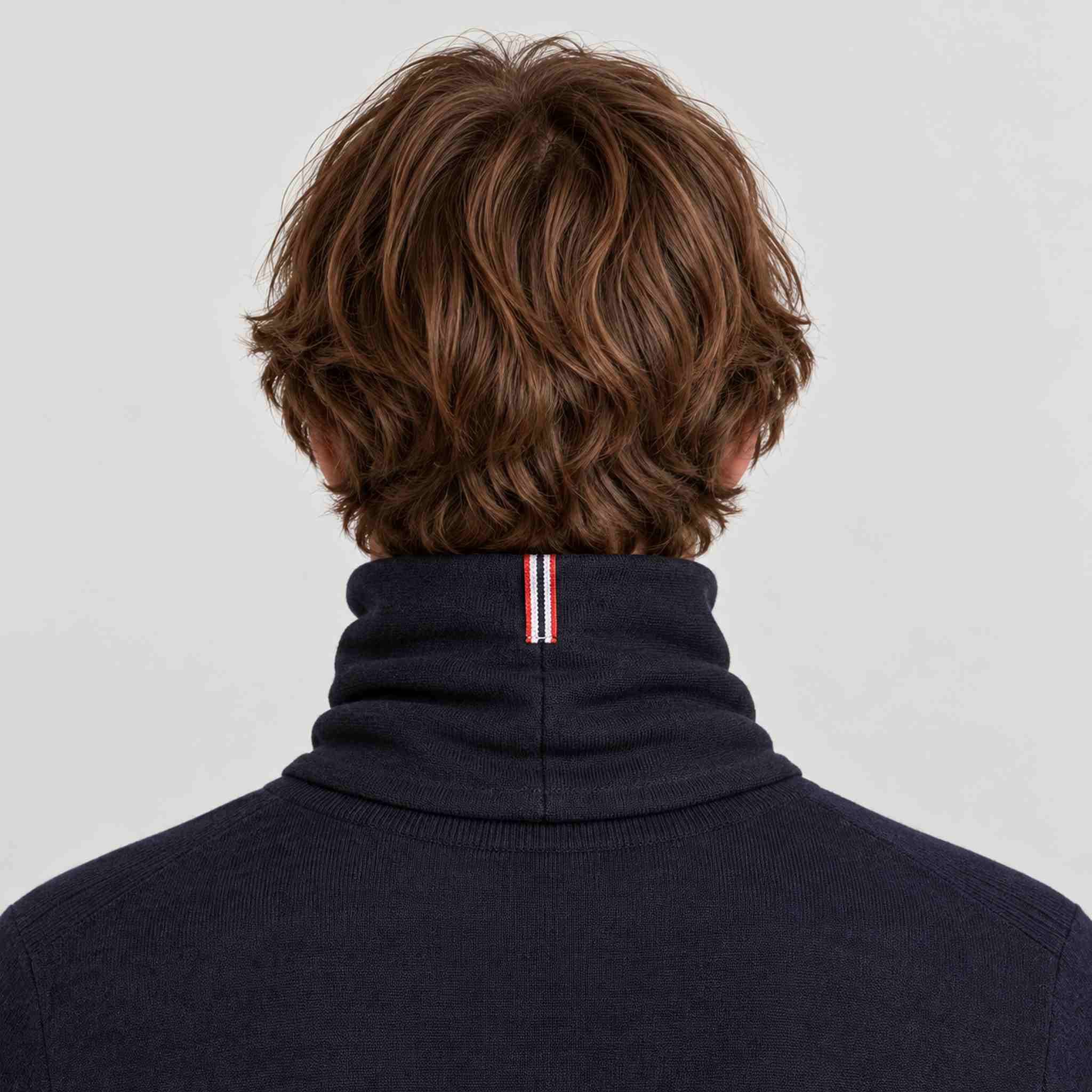 Amundsen Neckwarmer in Faded Navy, back view worn by a male model.