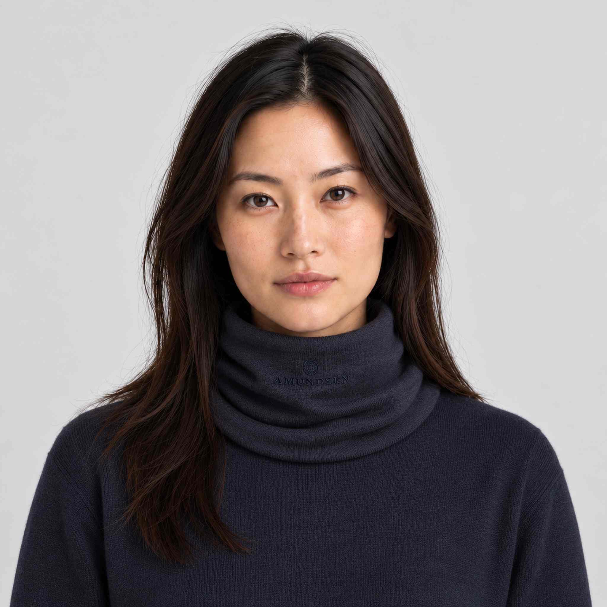 Amundsen Neckwarmer in Faded Navy, front view worn by a female model.