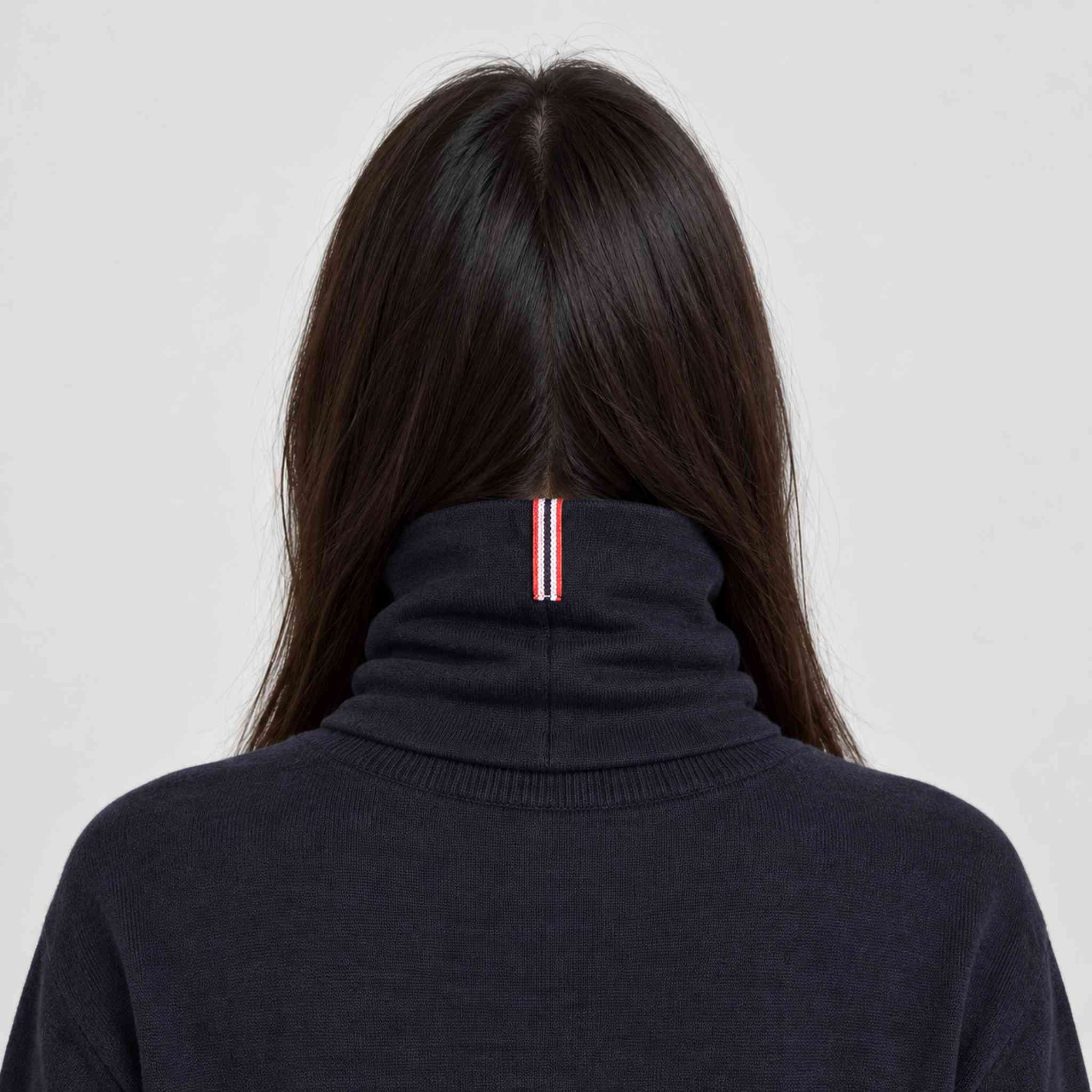 Amundsen Neckwarmer in Faded Navy, back view worn by a female model.