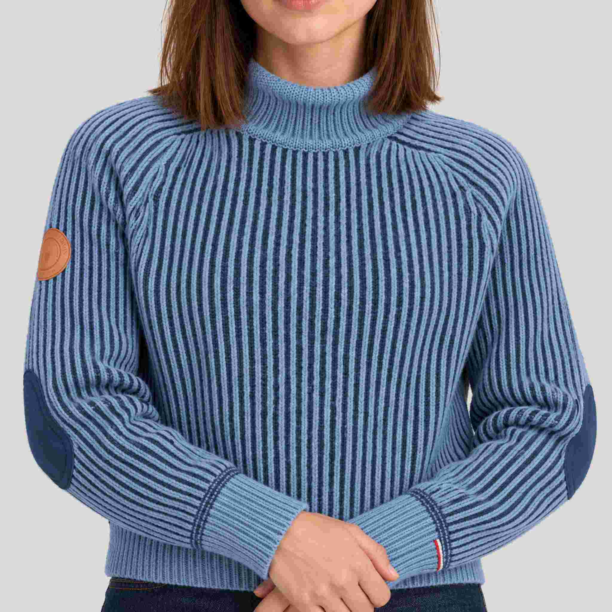 Amundsen Gard Sweater in Fjord Blue, close-up fabric detail on model.