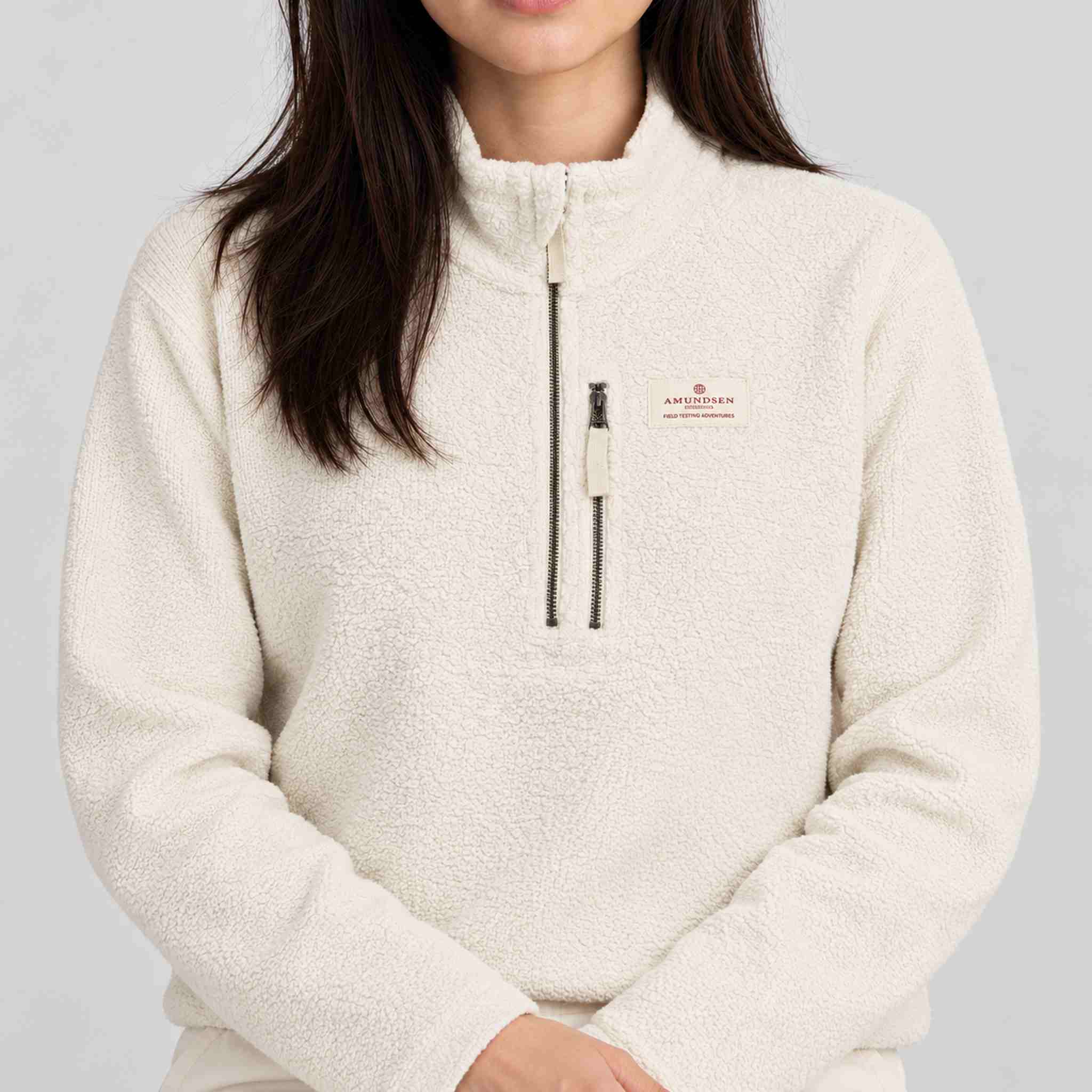 Amundsen Hut Half Zip in Oatmeal, close-up fabric detail on model.
