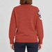 Amundsen Peak Half Zip in Terra Red, back view on model.