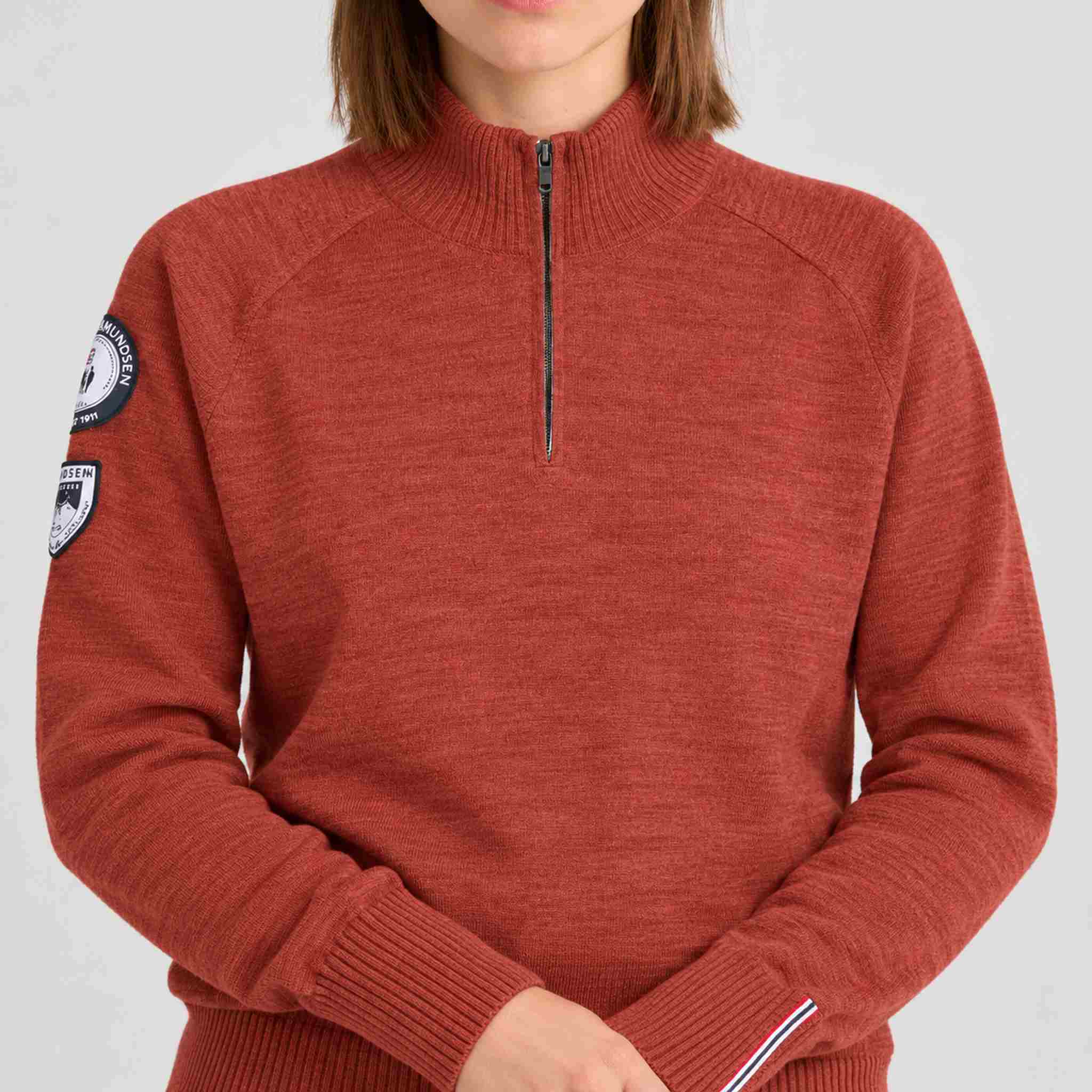 Amundsen Peak Half Zip in Terra Red, close-up fabric detail on model.