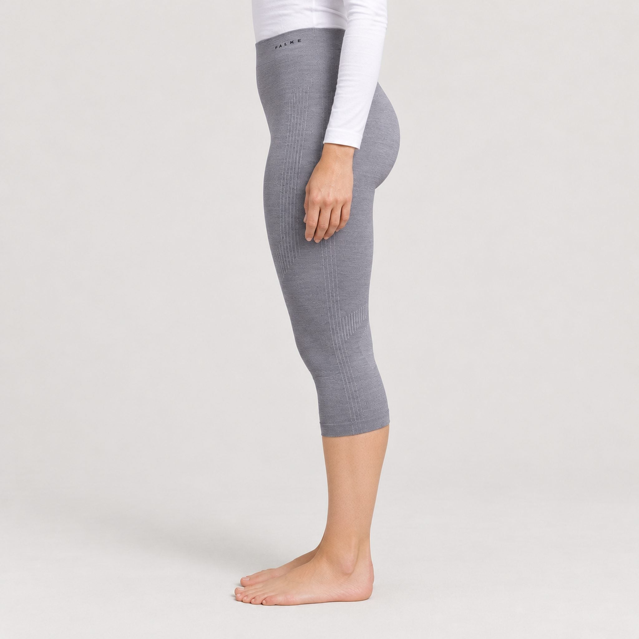 Falke women's Wool Tech 3/4 Leggings in Grey – model side