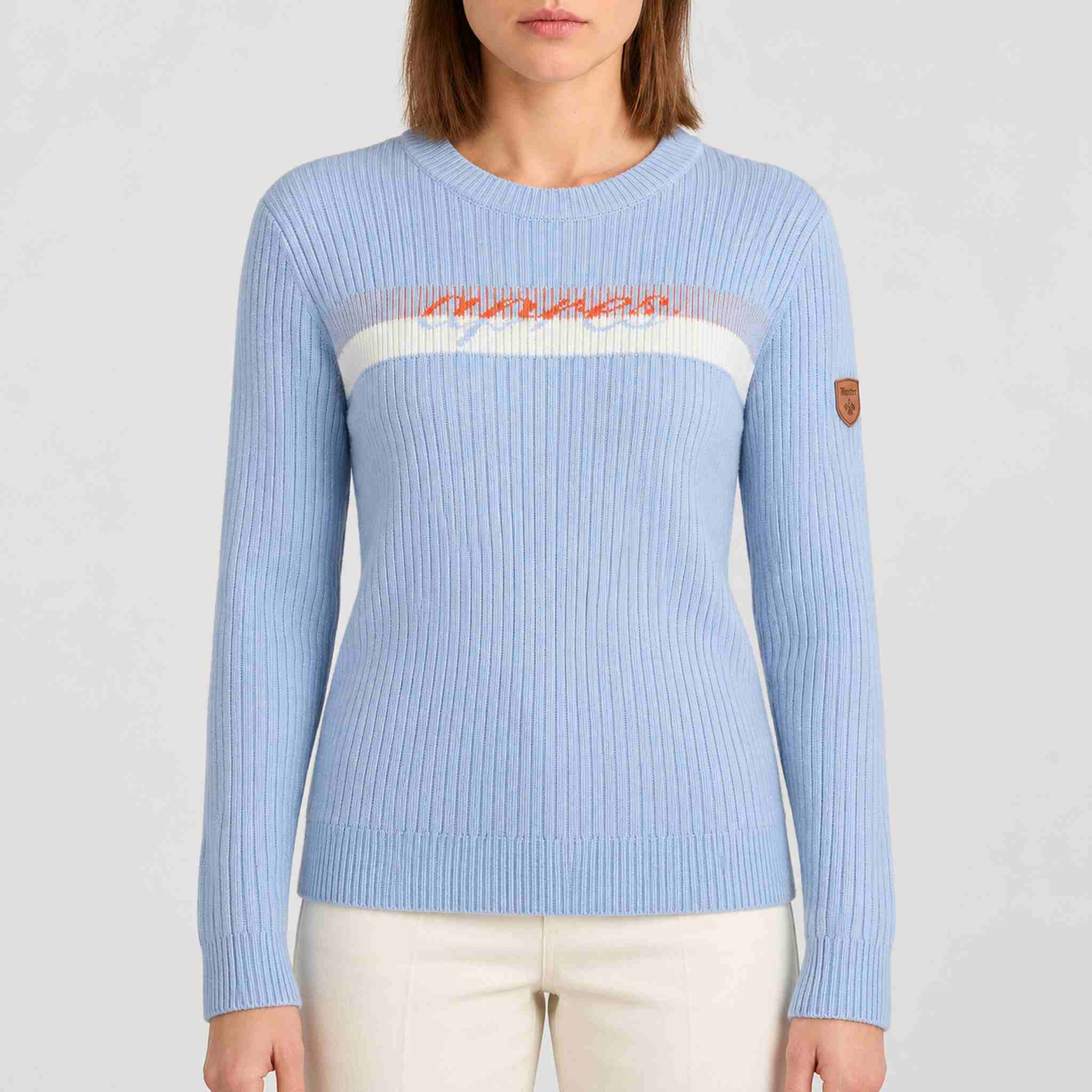 Fera women's Apres Sweater in Sky Blue, rib knit and chest detail on model.