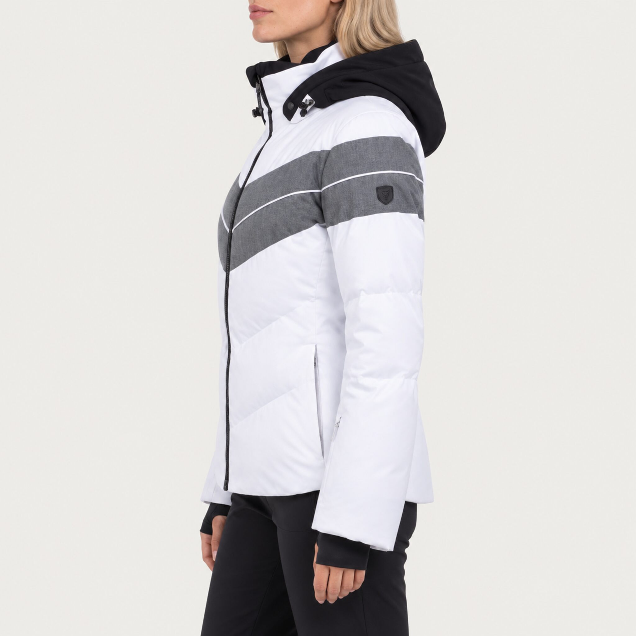 Fera women's Ariel Ski Jacket in White, side view on model.
