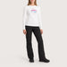 Fera women's Goggle Tee in White, full outfit on model.