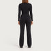 Fera women's High Heaven Pant in Black, back view on model.