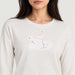 Fera women's Martini Run Tee in Ivory, close-up showing fabric and design.