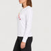 Fera women's Shades of Apres Tee in White, side view on model.