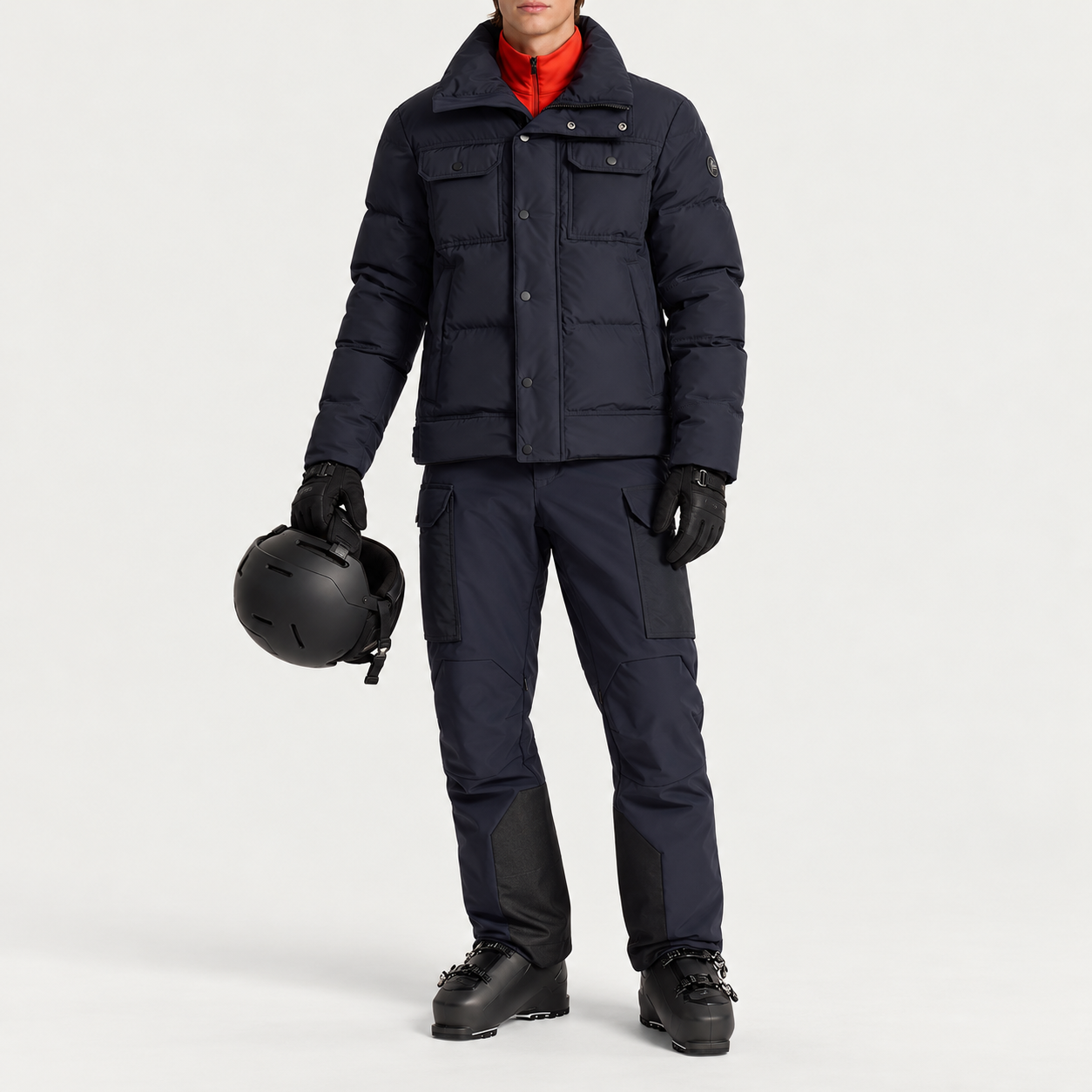 Fusalp men's Carlo Ski Jacket in Marin, full outfit on model holding a ski helmet.