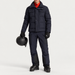 Fusalp men's Carlo Ski Jacket in Marin, full outfit on model holding a ski helmet.