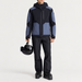 Fusalp men's Lirsan Ski Jacket in Black/Grey Sea, full outfit on model holding a ski helmet.