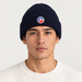 Fusalp unisex Cosmic Beanie in Navy, front view on male model.