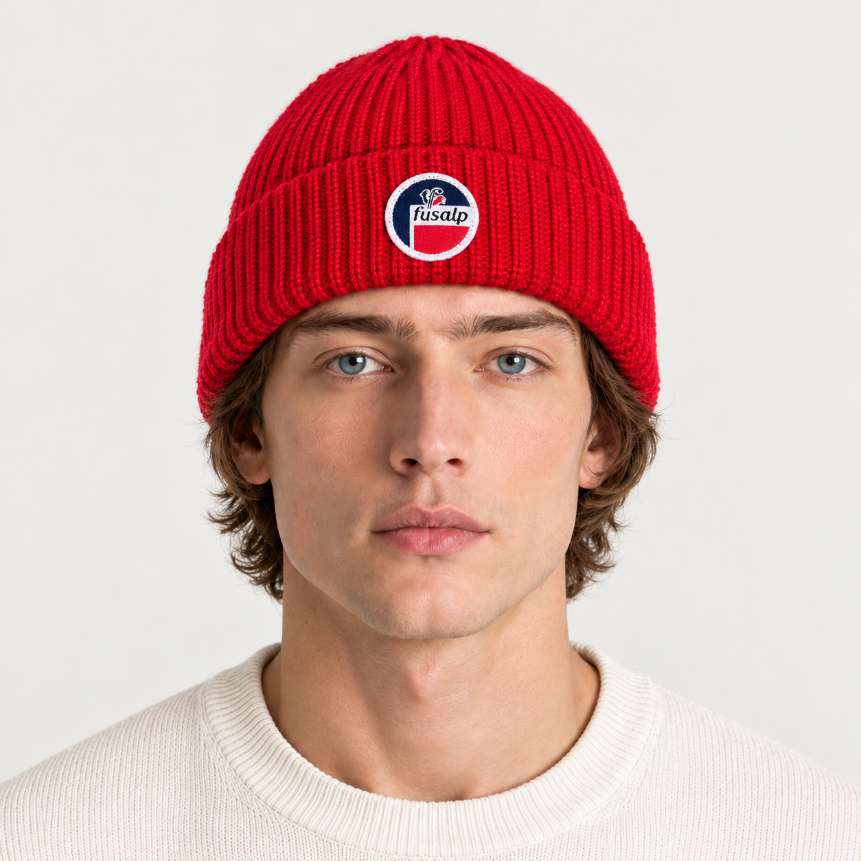 Fusalp unisex Cosmic Beanie in Red, front view on male model.