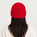 Fusalp unisex Cosmic Beanie in Red, view on female model.