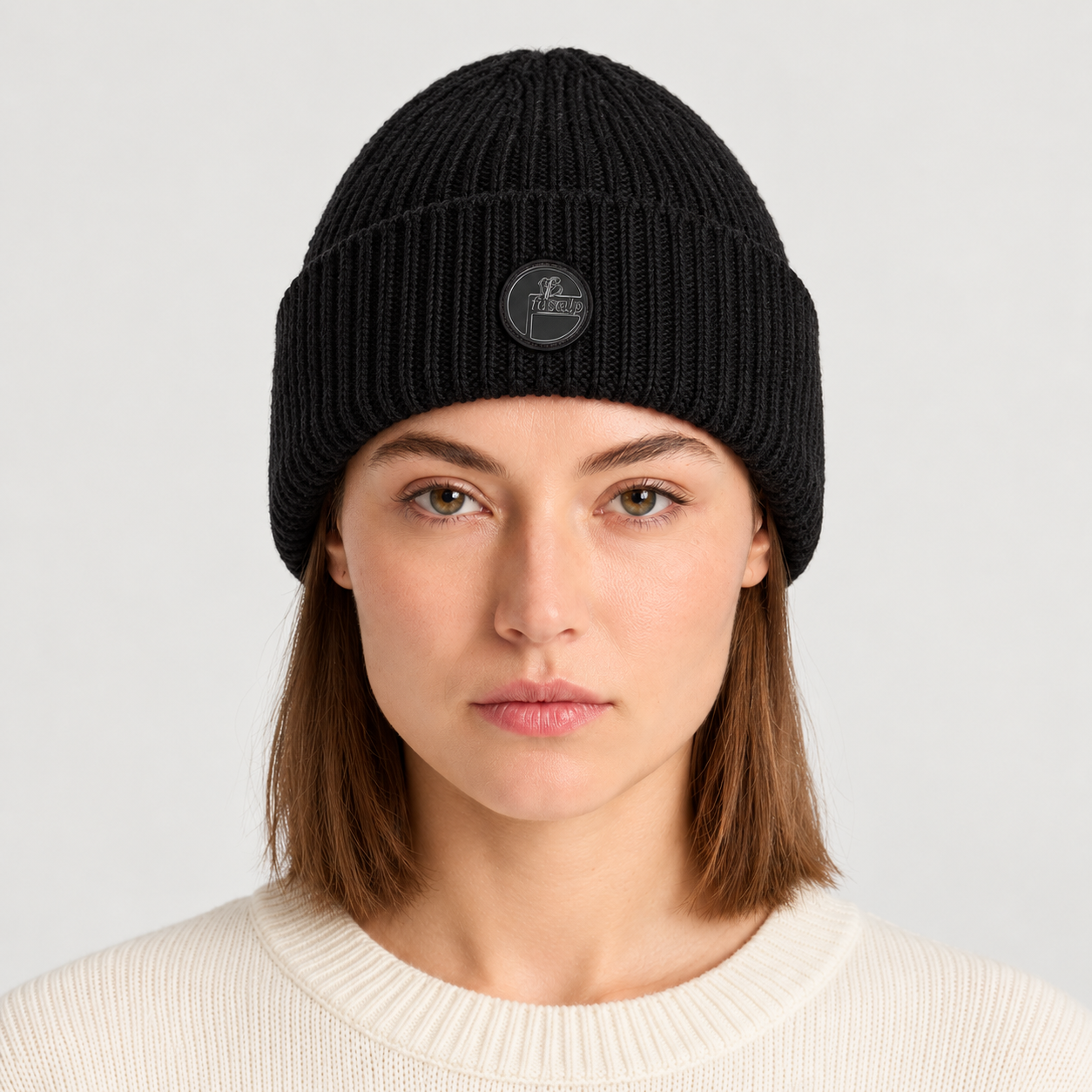 Fusalp unisex Knit II Beanie in Black, front view on female model.