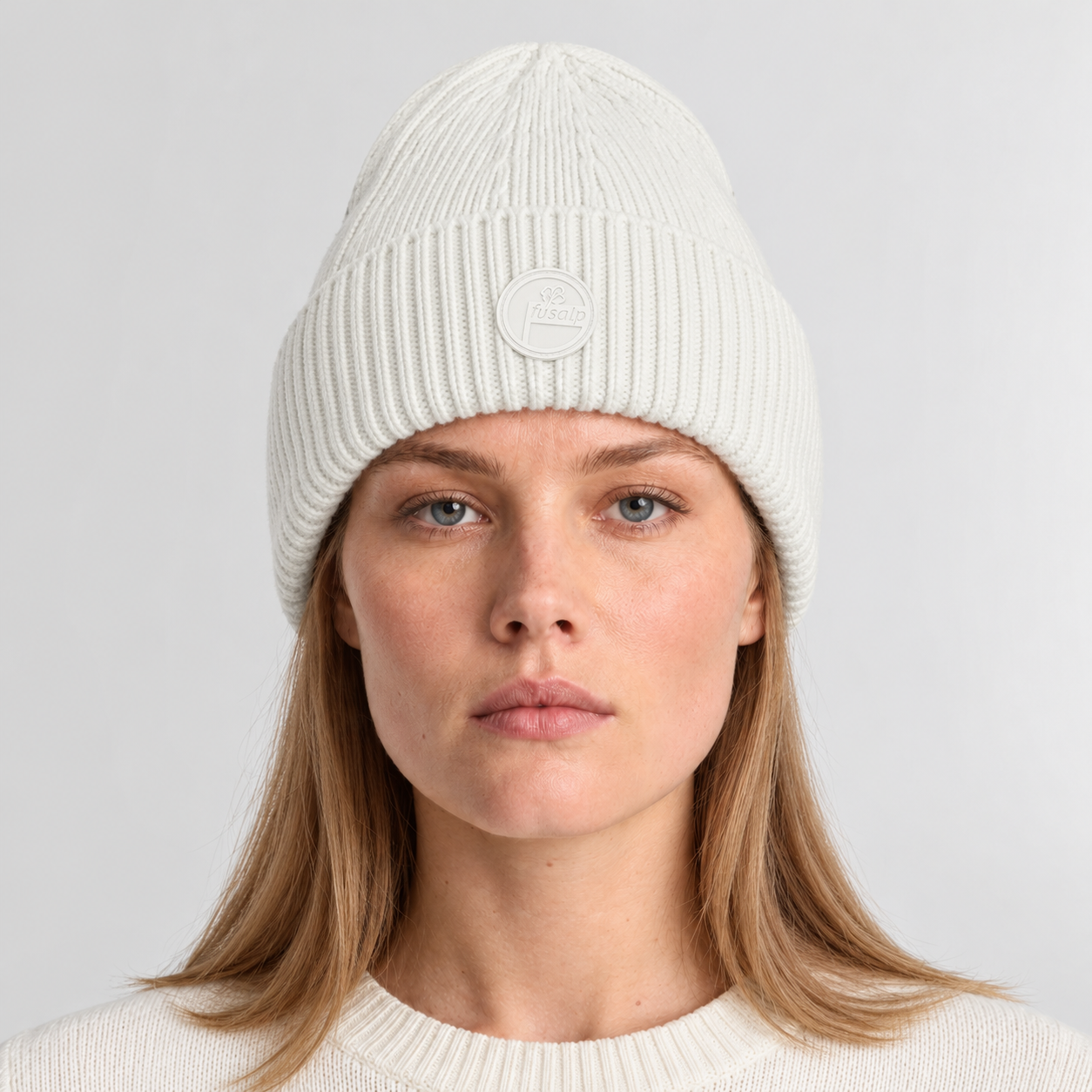 Fusalp unisex Knit II Beanie in White, front view on female model.